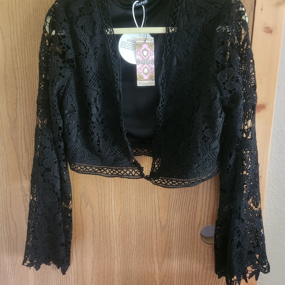 Black Crop Shrug Lace Over Jacket. Eyehook Closure. Lined Body. Lace Sleeves NWT